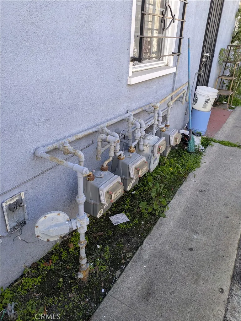 6809 Heliotrope Avenue Bell, CA 90201 - Photo 15 of 18 a front view of a house with a yard