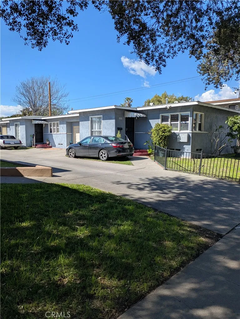 6809 Heliotrope Avenue Bell, CA 90201 - Photo 2 of 18 a house view with a garden space