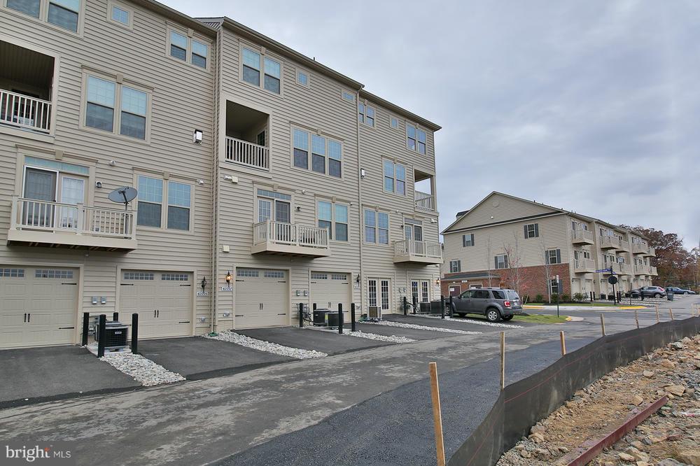 8026 Orchard Grove Road, Unit 11H Odenton, MD 21113 - Photo 2 of 30 ONE CAR GARAGE WITH DRIVEWAY