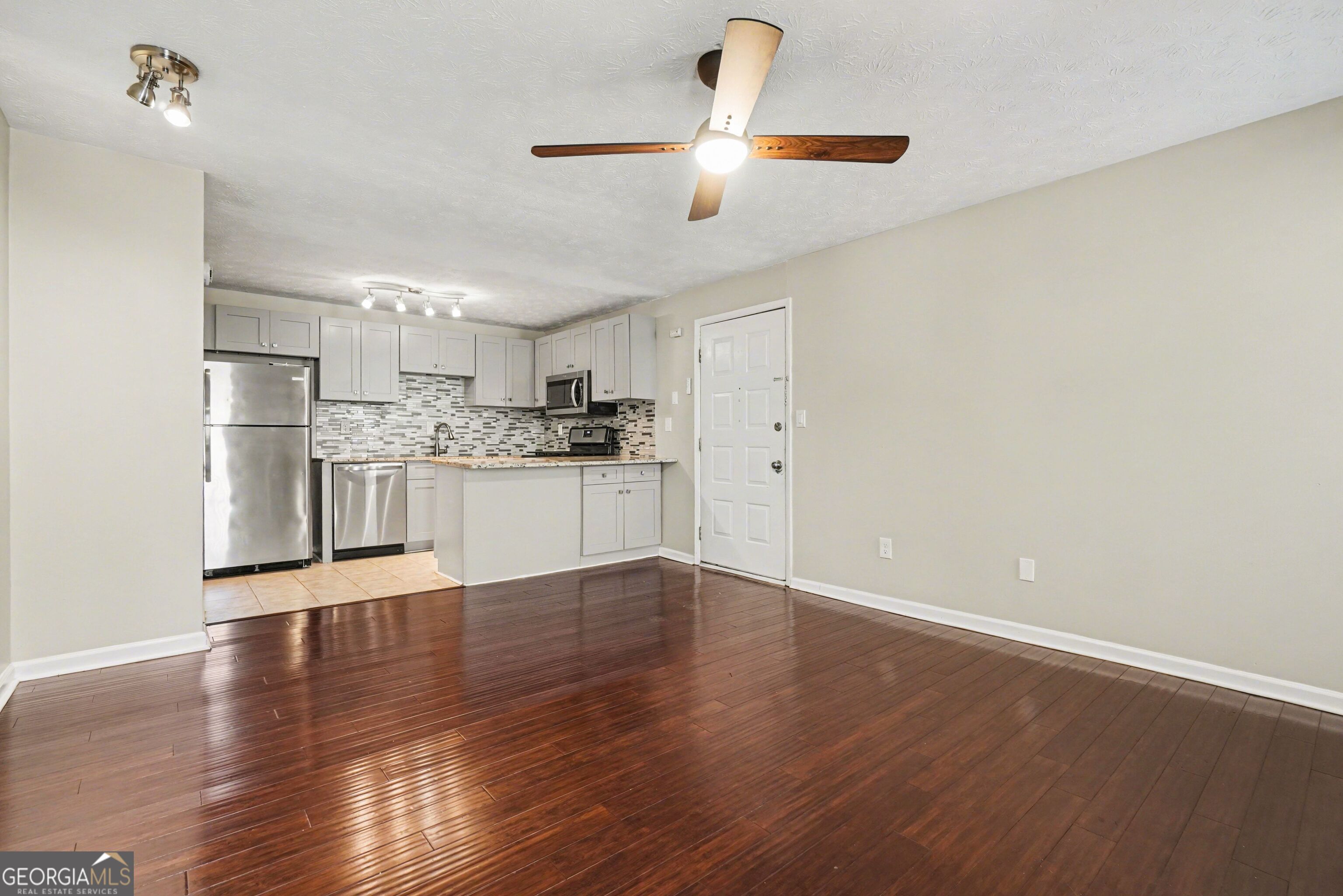 918 Dunbar Drive Atlanta, GA 30338 - Photo 1 of 16 a view of a kitchen with a sink wooden cabinets and stainless steel appliances