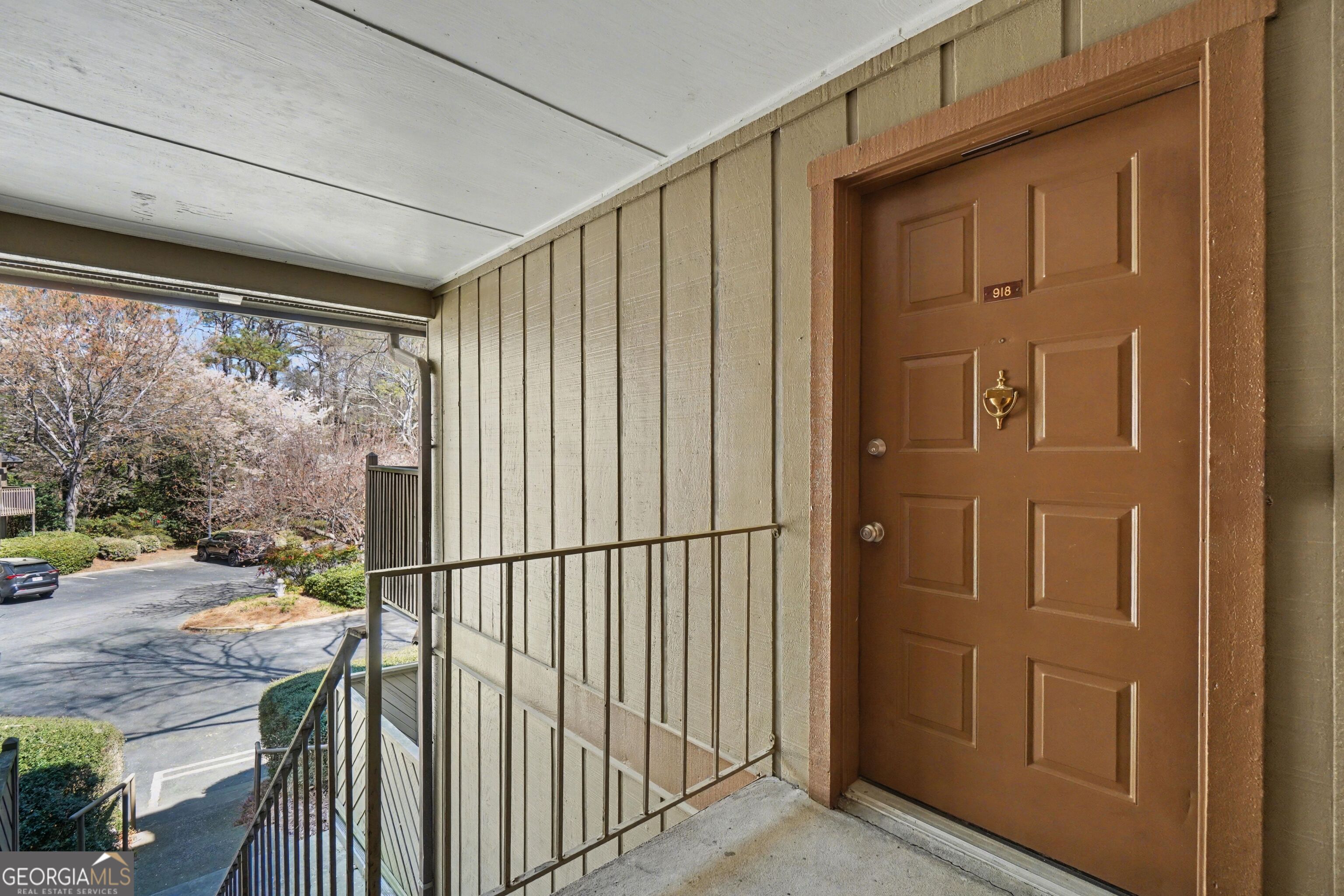 918 Dunbar Drive Atlanta, GA 30338 - Photo 2 of 16 a view of a porch with a door and wooden floor