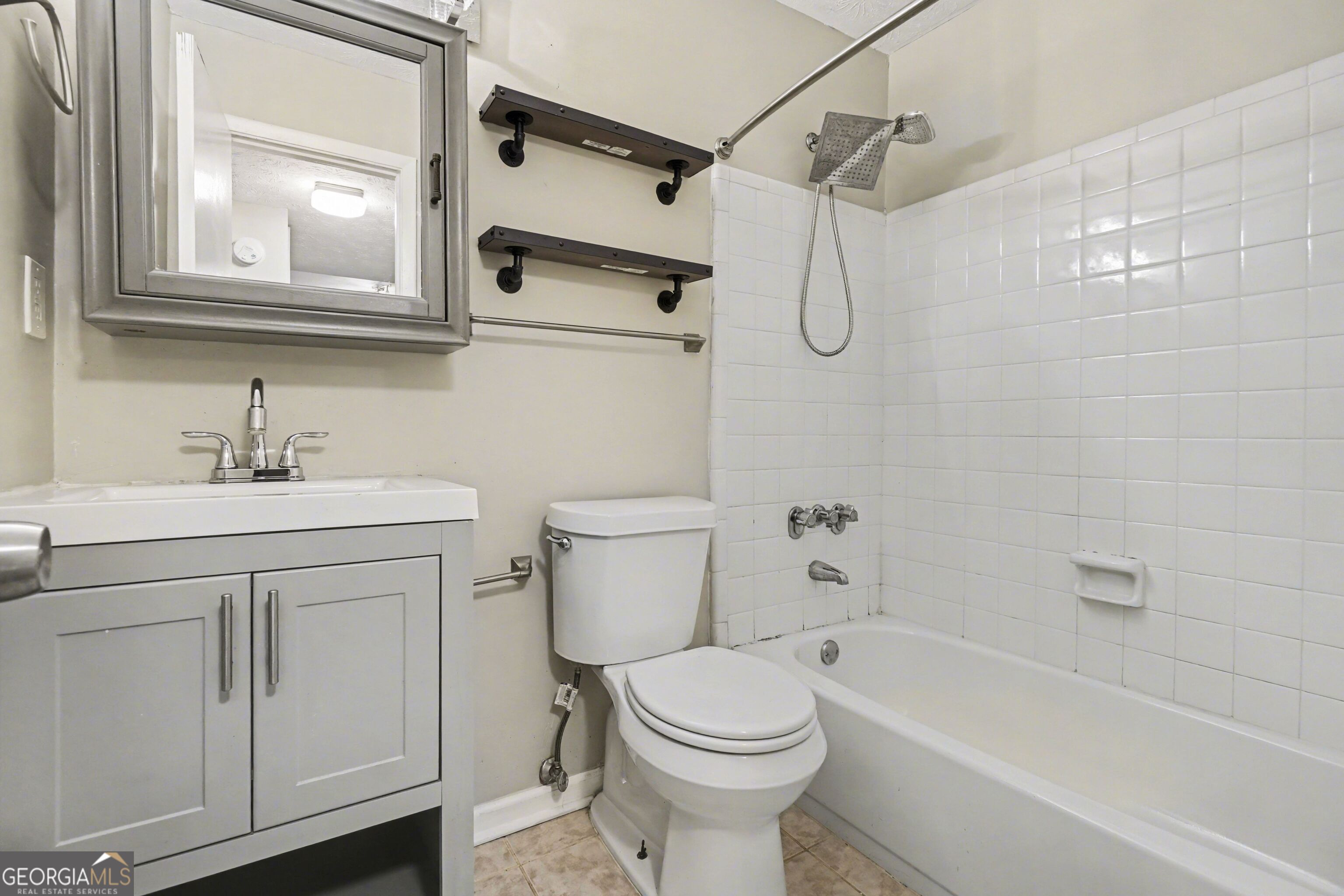918 Dunbar Drive Atlanta, GA 30338 - Photo 7 of 16 a bathroom with a sink vanity granite toilet and shower