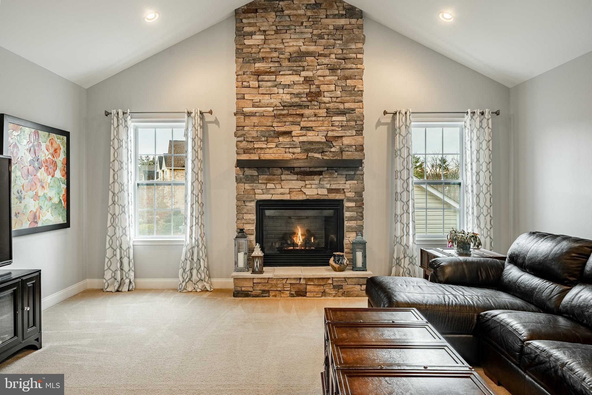 3000 Tyler Way Chalfont, PA 18914 - Photo 16 of 73 a living room with furniture and a fireplace