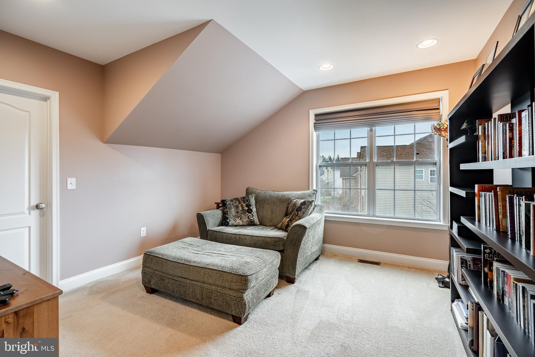 3000 Tyler Way Chalfont, PA 18914 - Photo 30 of 73 a living room with furniture a bookshelf and a window
