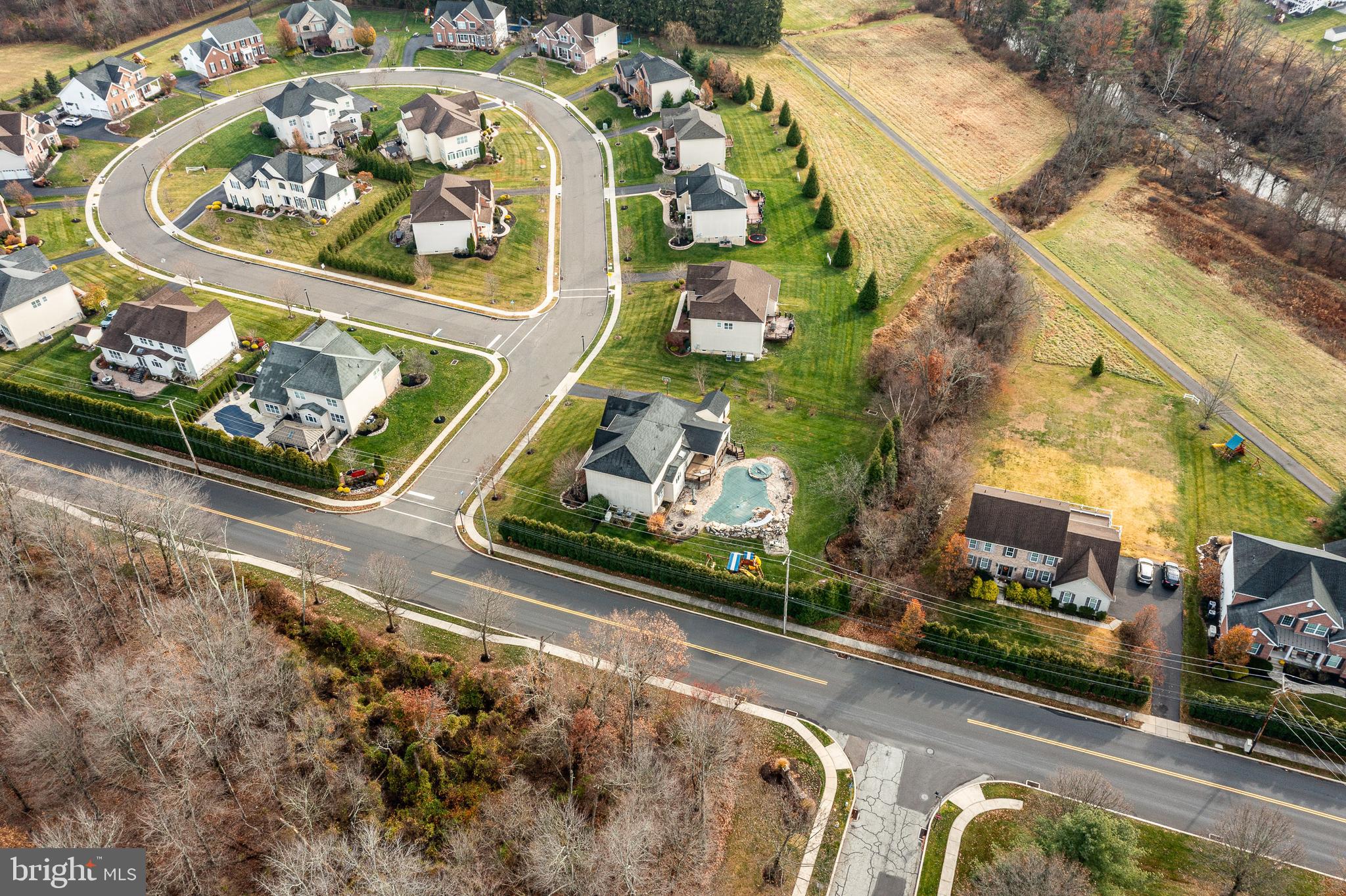 3000 Tyler Way Chalfont, PA 18914 - Photo 70 of 73 an aerial view of a swimming pool with a yard and plants