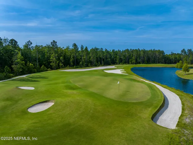 a view of a golf course with a lake