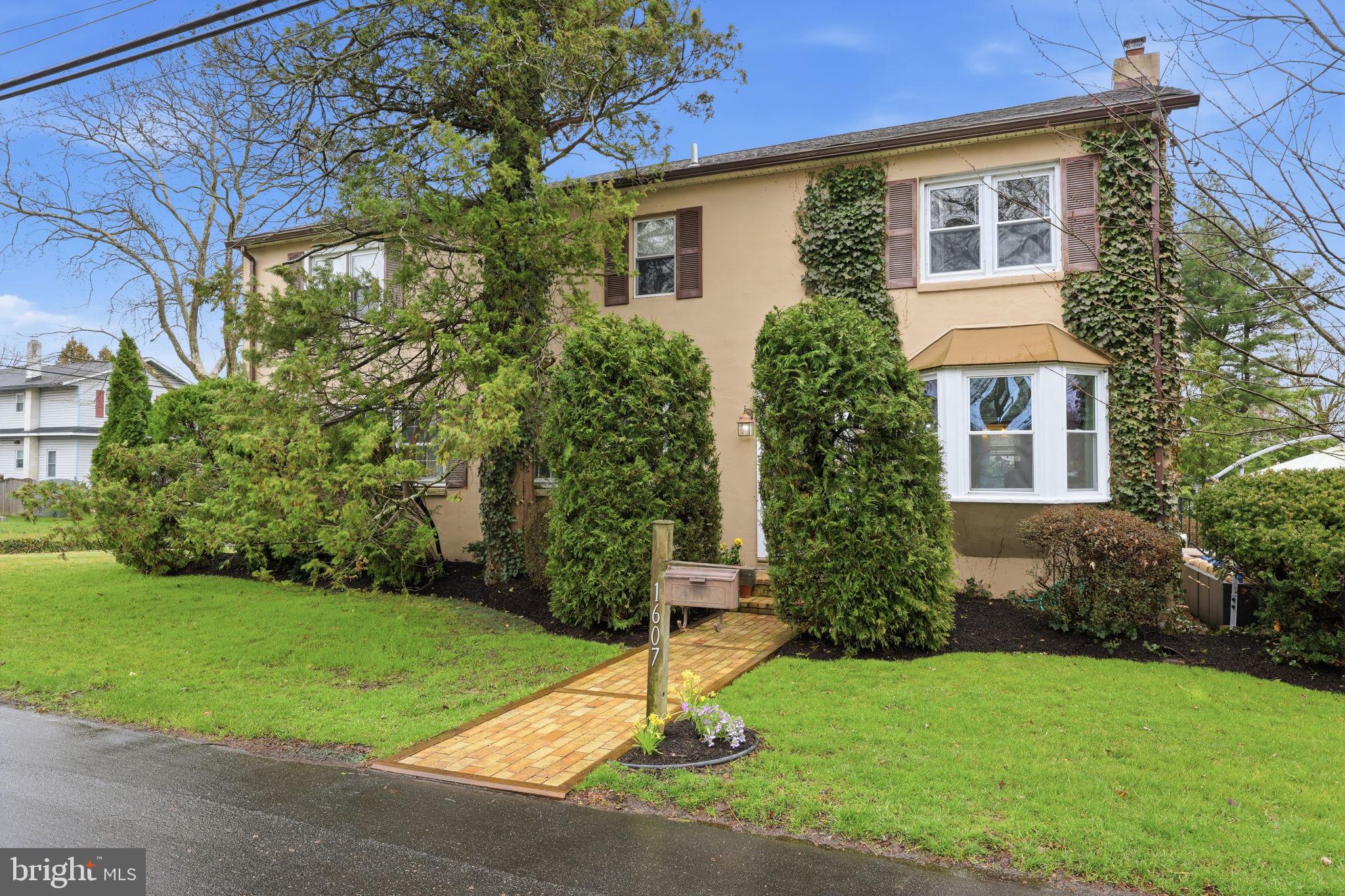 1607 Forrest Avenue Feasterville-Trevose, PA 19053 - Photo 1 of 48 a house with garden in front of it