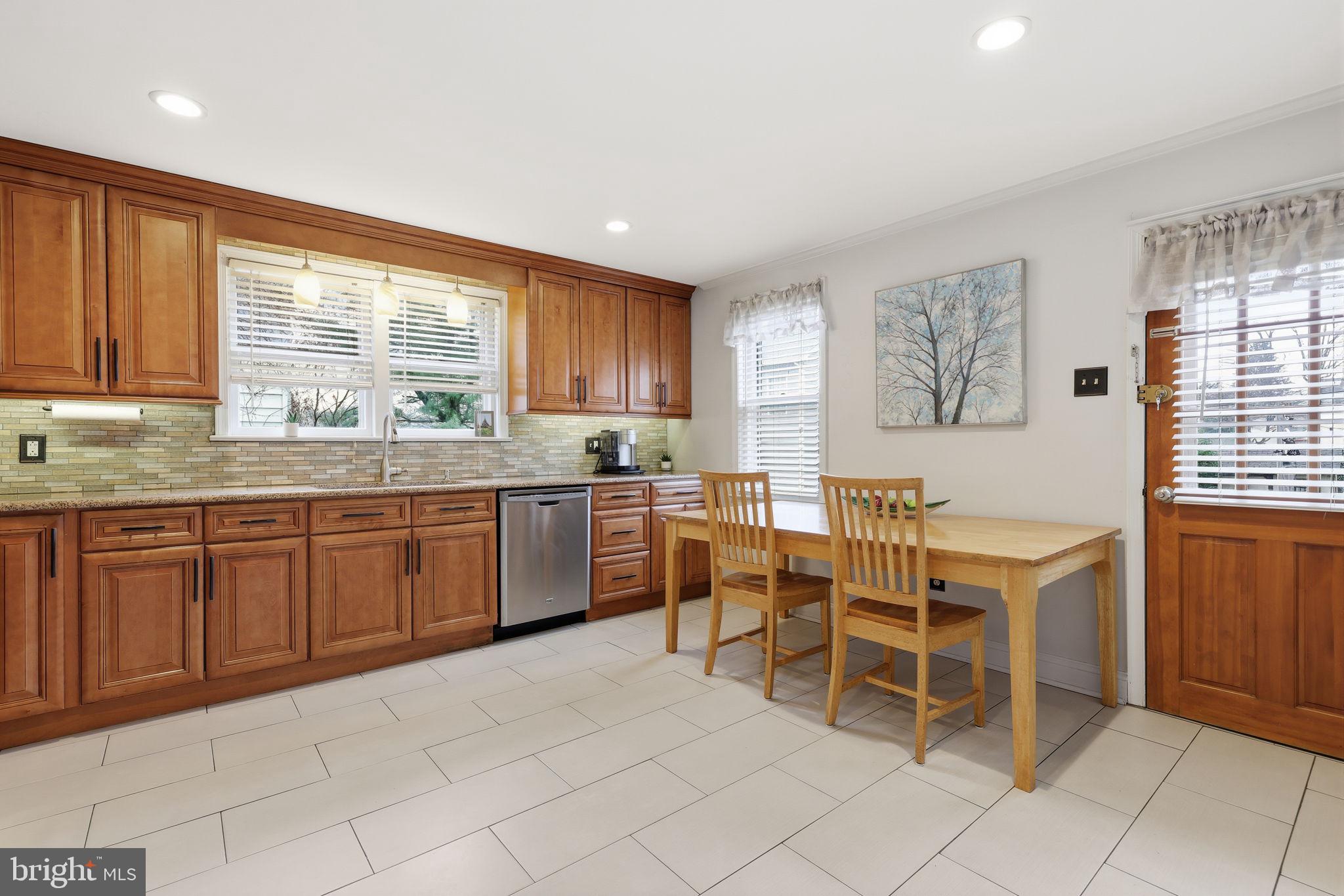 1607 Forrest Avenue Feasterville-Trevose, PA 19053 - Photo 12 of 48 a kitchen with a sink window and cabinets