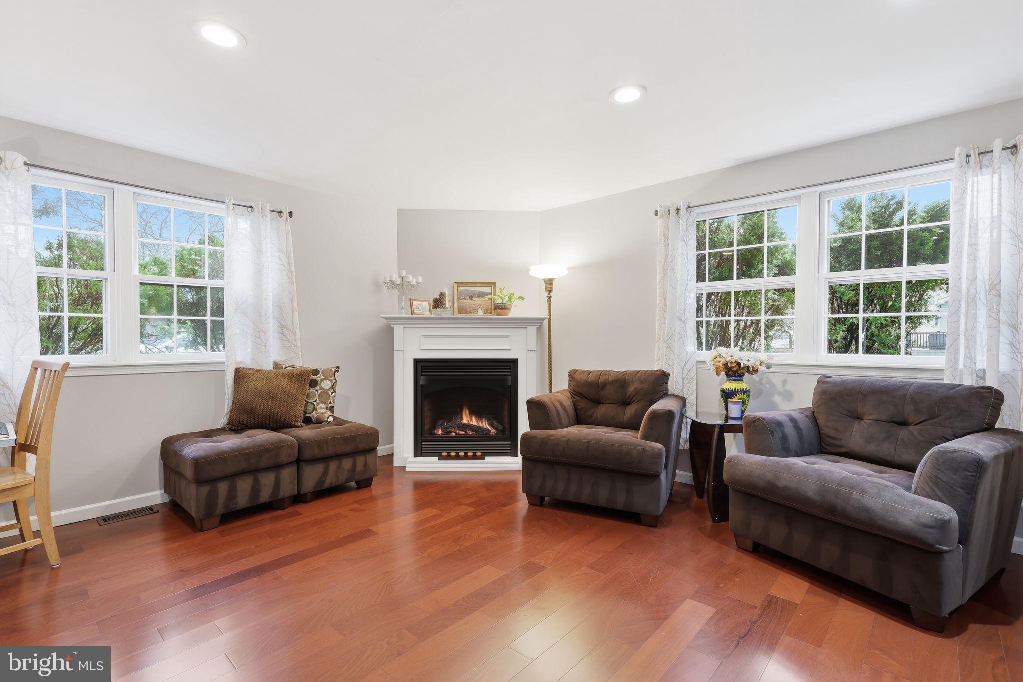 1607 Forrest Avenue Feasterville-Trevose, PA 19053 - Photo 18 of 48 a living room with furniture and a fireplace
