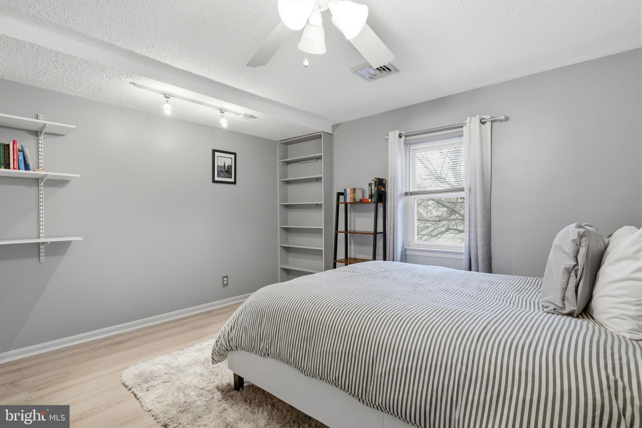 1607 Forrest Avenue Feasterville-Trevose, PA 19053 - Photo 27 of 48 a bedroom with a bed and a large mirror