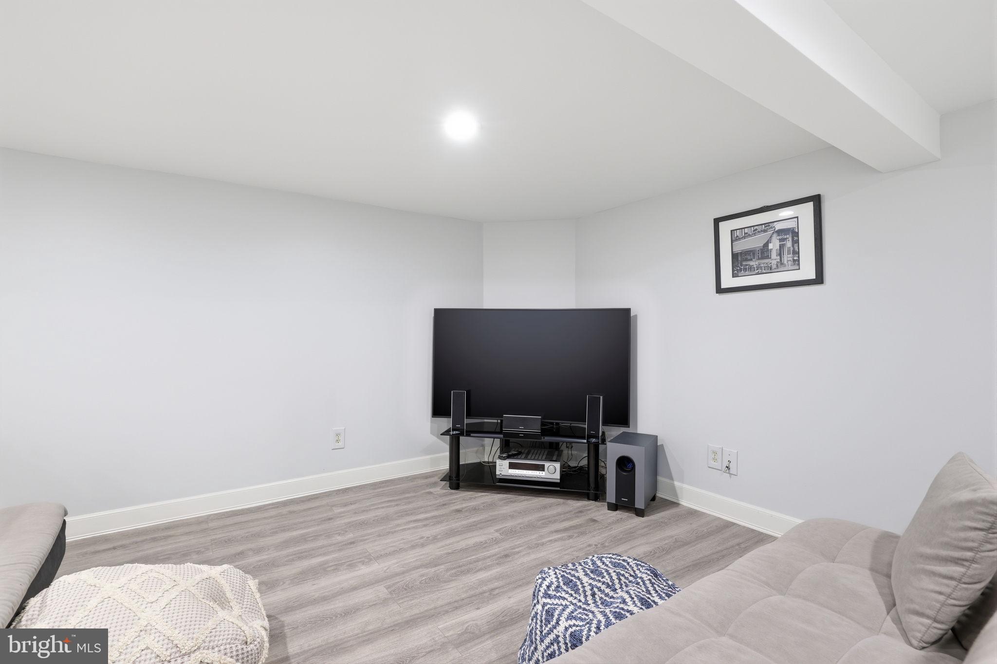 1607 Forrest Avenue Feasterville-Trevose, PA 19053 - Photo 36 of 48 a room with a bed and a flat screen tv