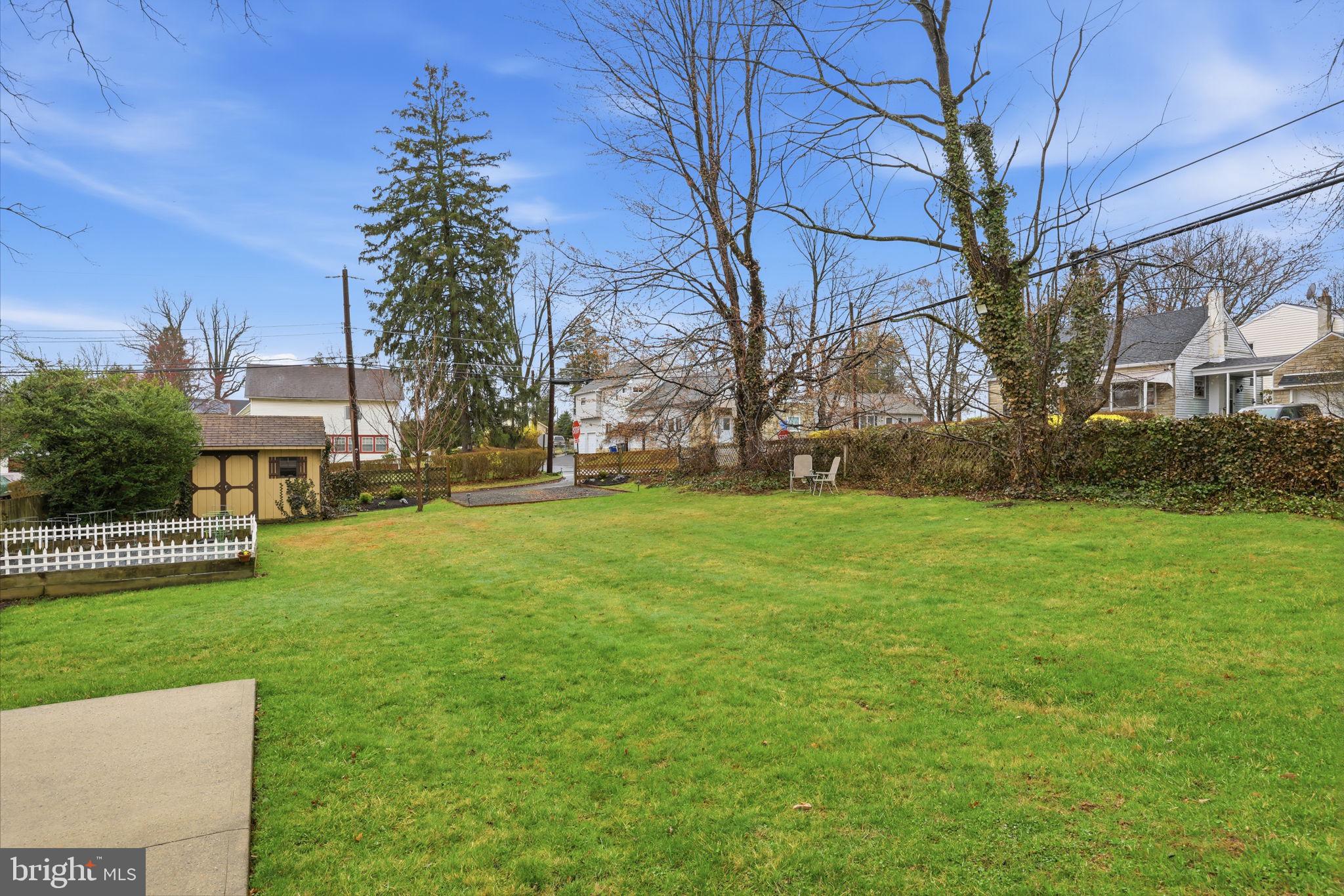 1607 Forrest Avenue Feasterville-Trevose, PA 19053 - Photo 43 of 48 a view of a yard with plants and large trees