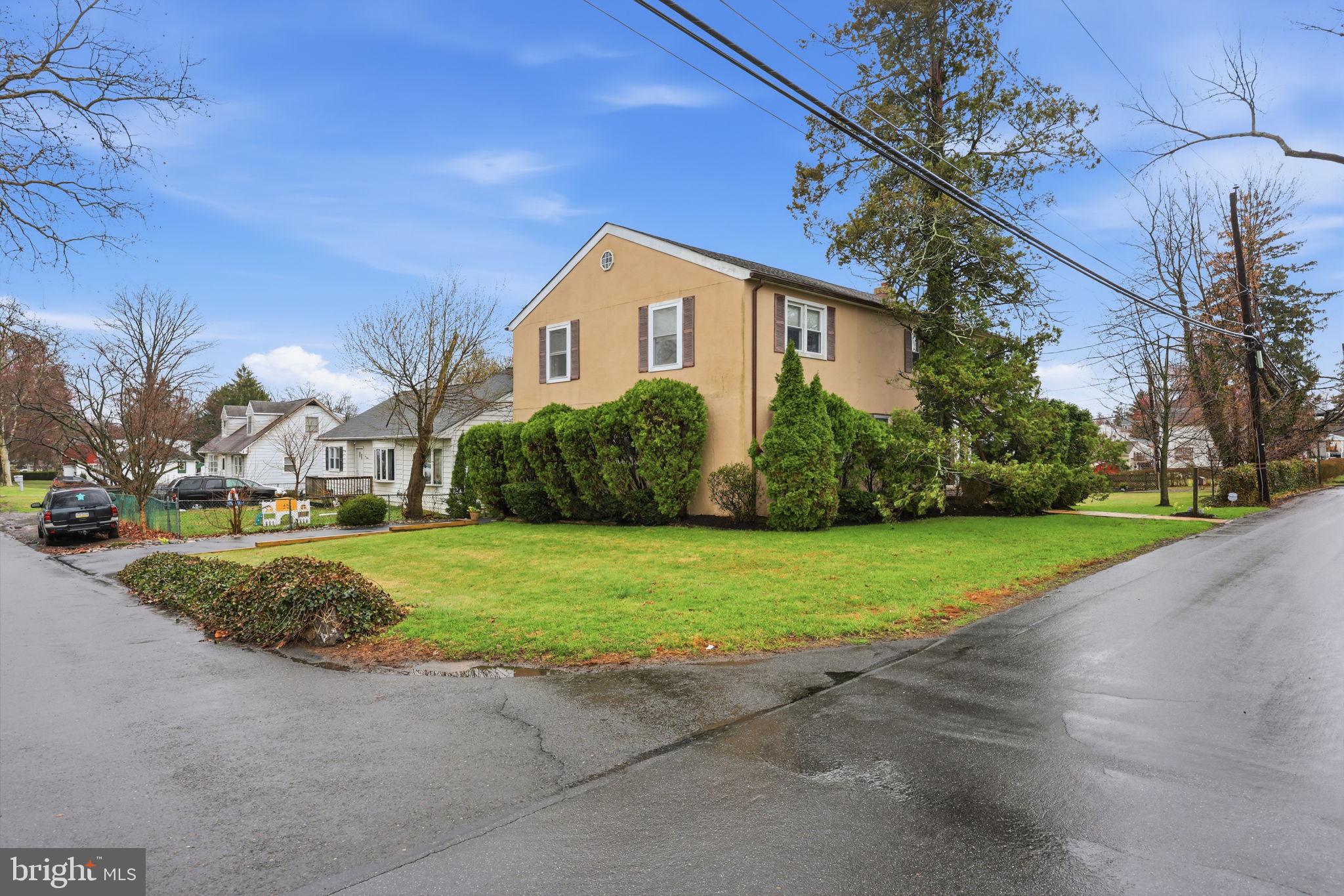1607 Forrest Avenue Feasterville-Trevose, PA 19053 - Photo 6 of 48 a front view of a house with a yard and garage
