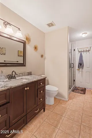 a bedroom with a bed and a closet