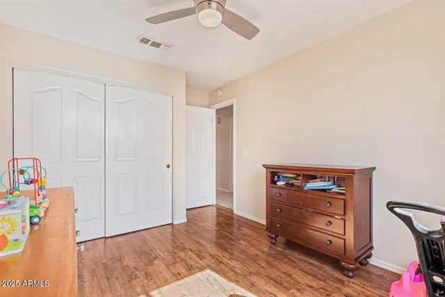 a spacious bathroom with a granite countertop sink toilet and shower