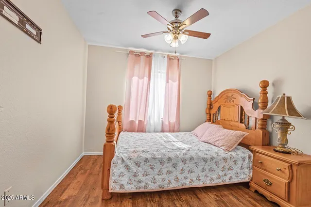 a view of room with hardwood floor and cabinet