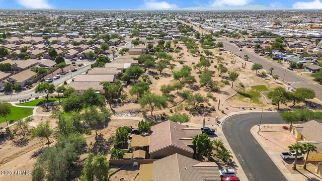 an aerial view of residential houses with outdoor space
