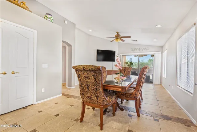 a kitchen with stainless steel appliances granite countertop a stove refrigerator and sink