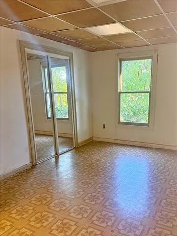 a bathroom with a tub sink and large mirror