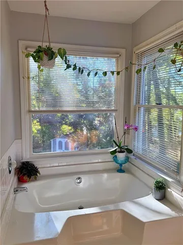 a view of a roof deck with wooden floor and fence
