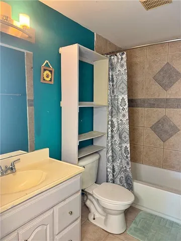 a bedroom with a bed and a table