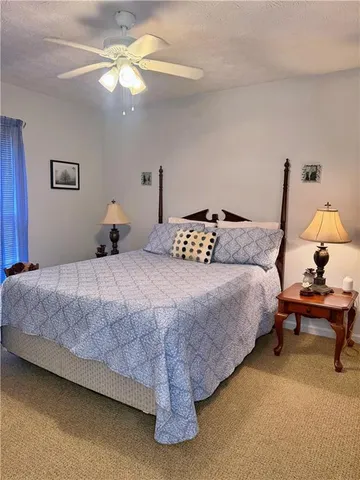 a kitchen with stainless steel appliances granite countertop a refrigerator a sink dishwasher a stove and a microwave oven on granite countertops