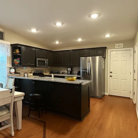 a dinning table and chairs in a room