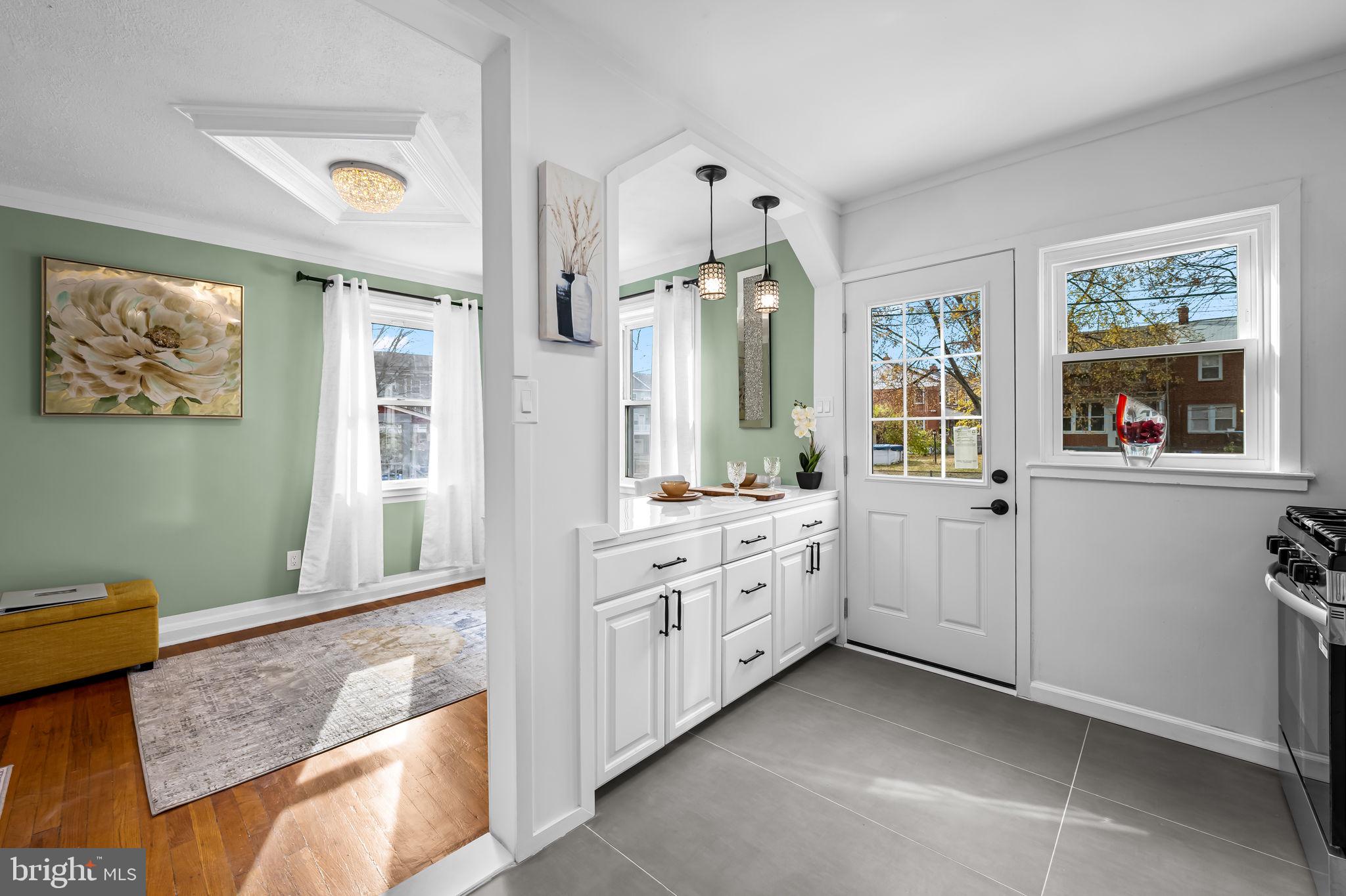 66 Stemmers Run Road Baltimore, MD 21221 - Photo 11 of 24 a spacious bathroom with a granite countertop sink mirror and a bathtub