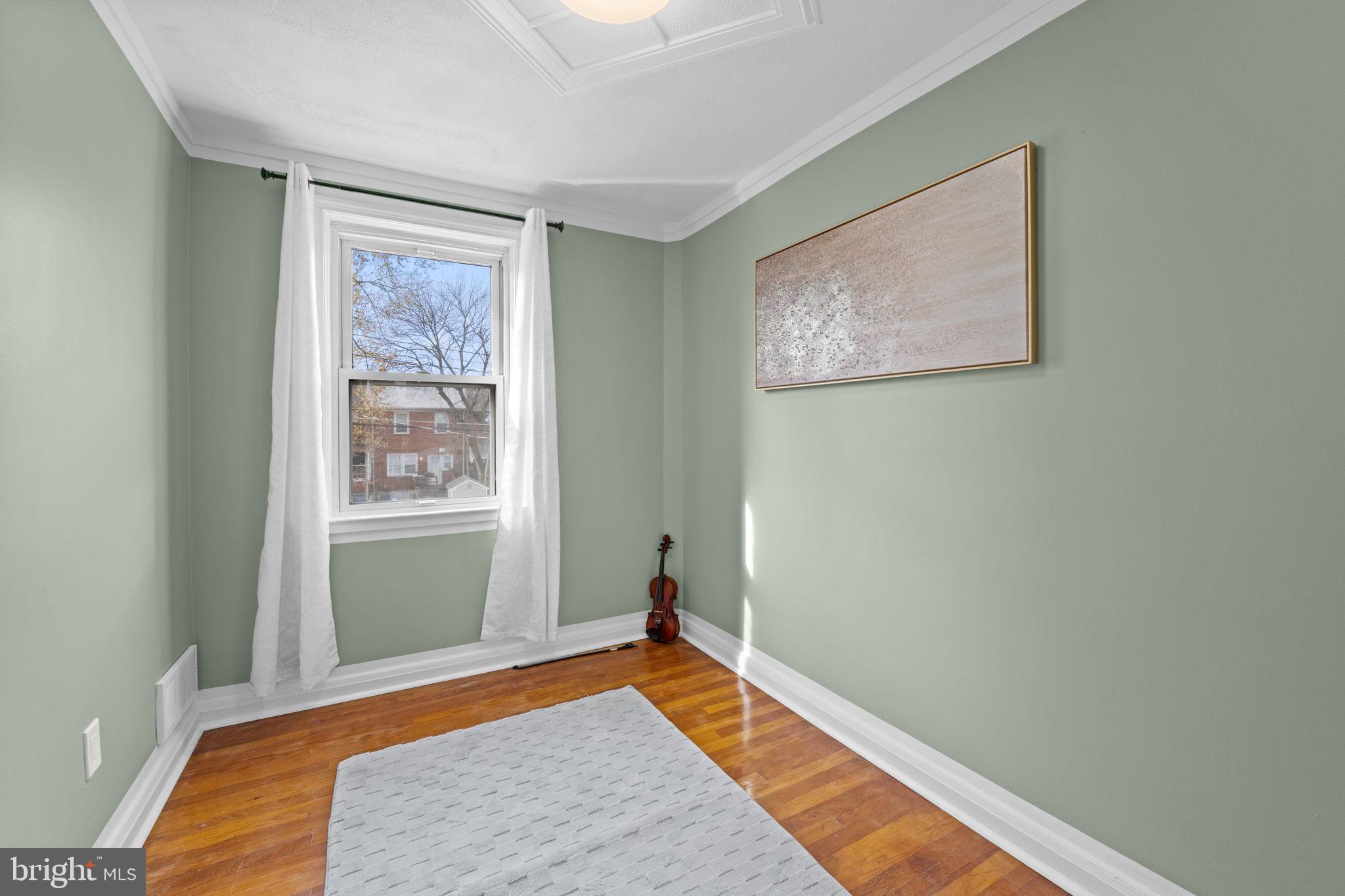 66 Stemmers Run Road Baltimore, MD 21221 - Photo 17 of 24 a bedroom with bed and window