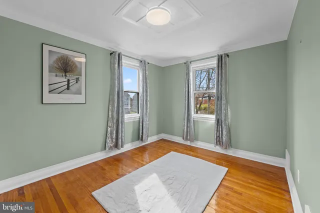 a view of a big room with windows and closet