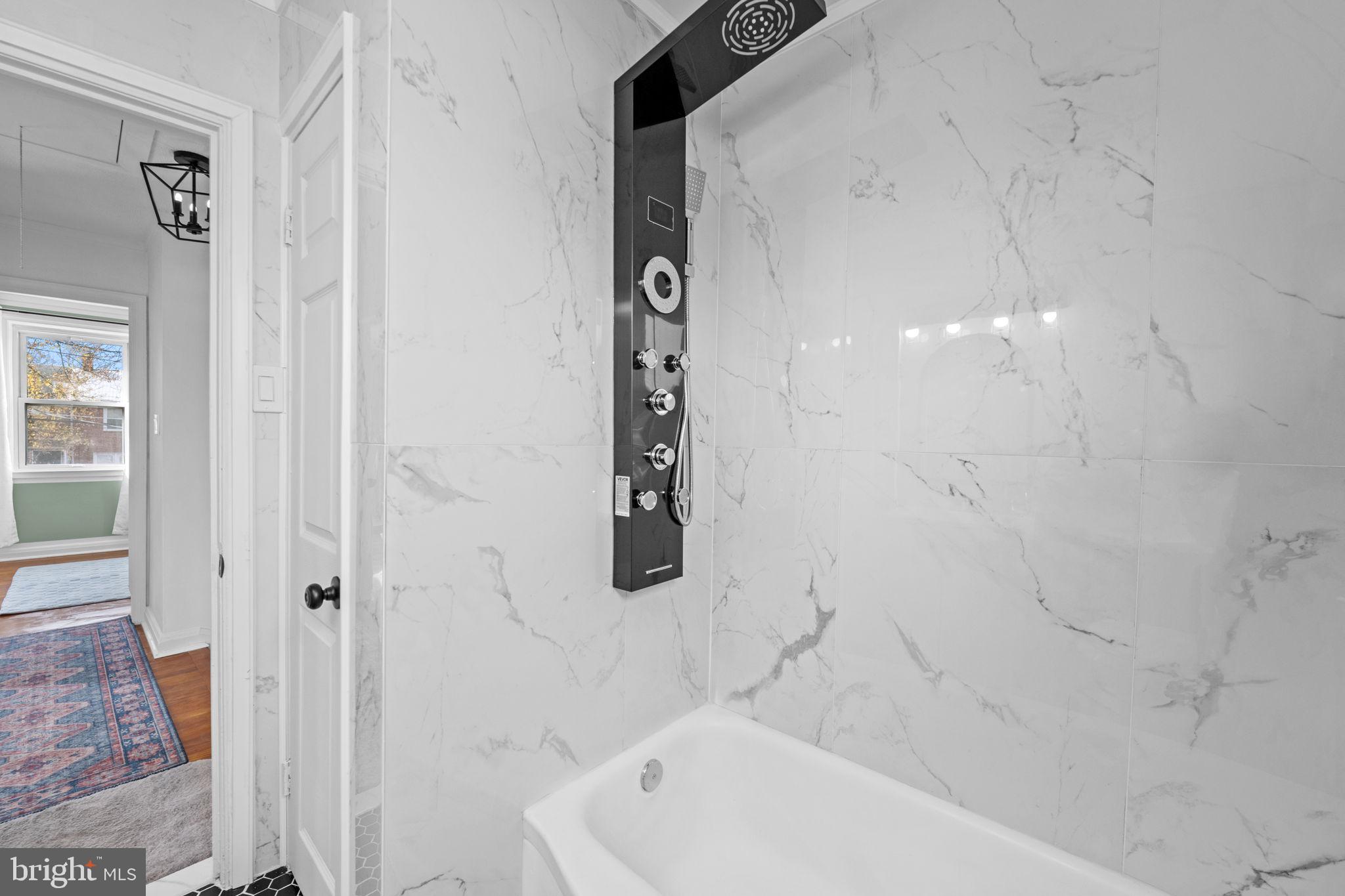 66 Stemmers Run Road Baltimore, MD 21221 - Photo 21 of 24 a bathroom with bathtub and shower