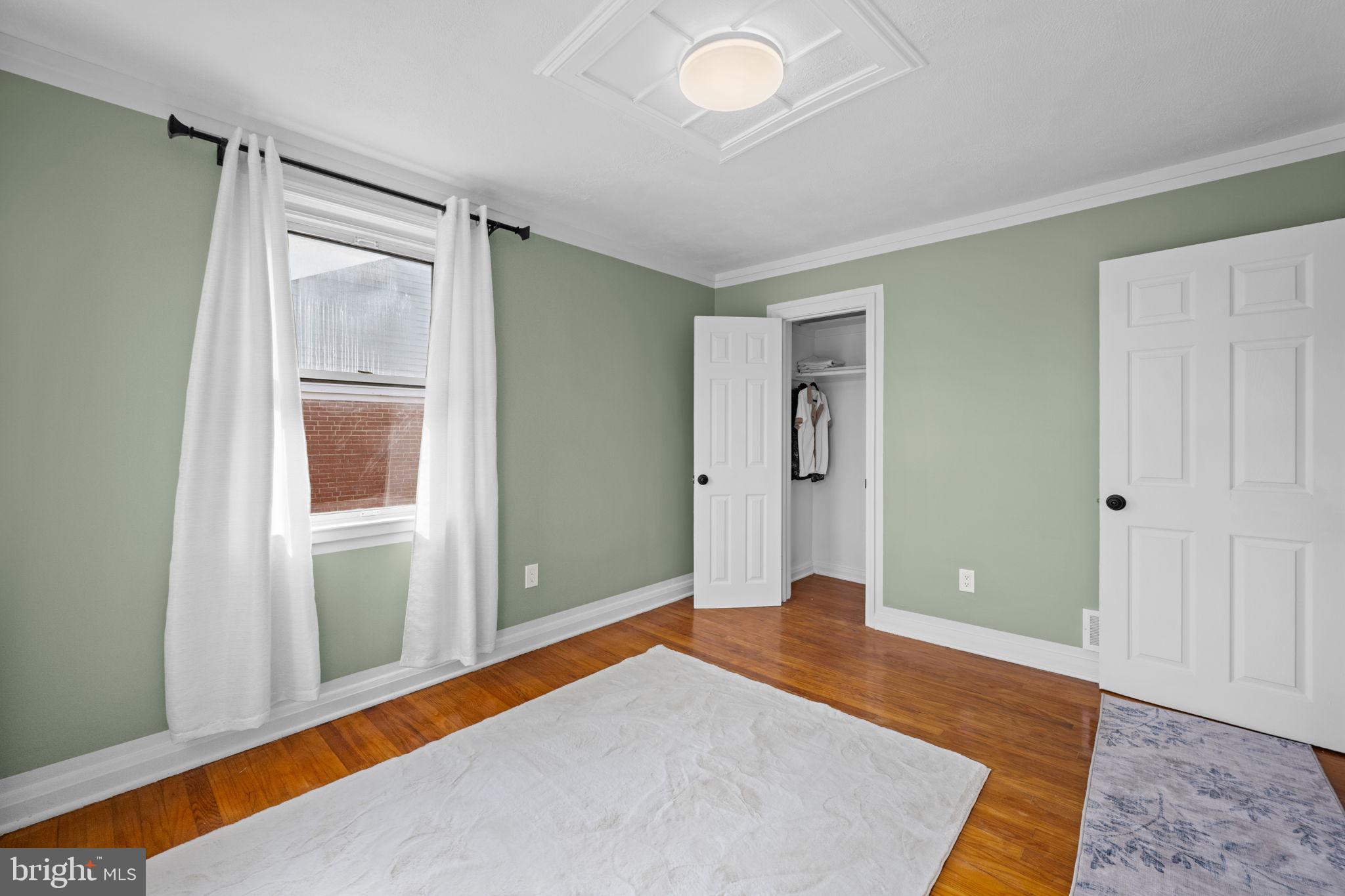 66 Stemmers Run Road Baltimore, MD 21221 - Photo 22 of 24 a bedroom with a bed and a window