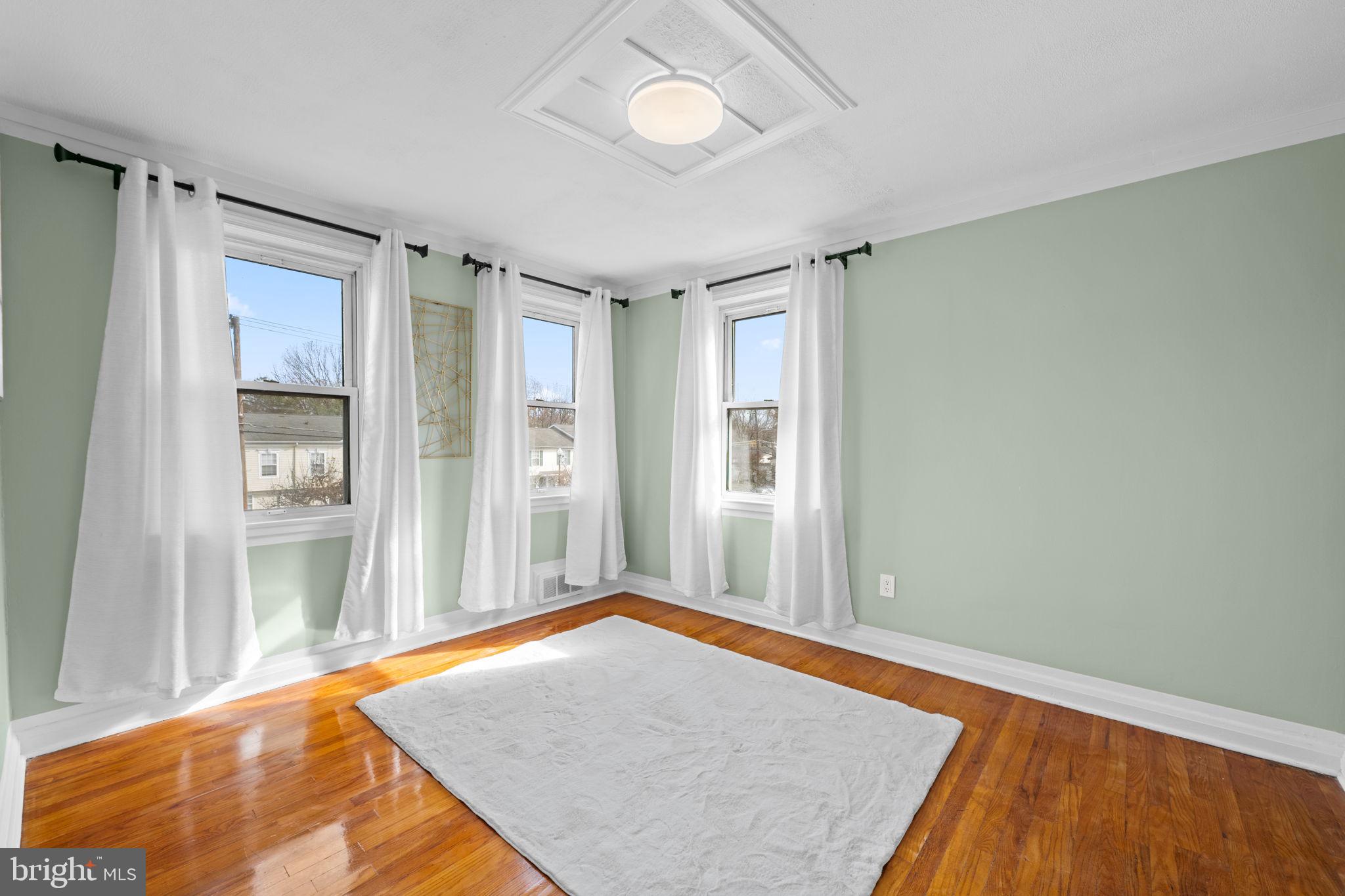 66 Stemmers Run Road Baltimore, MD 21221 - Photo 23 of 24 a view of a room with wooden floor and a cabinet