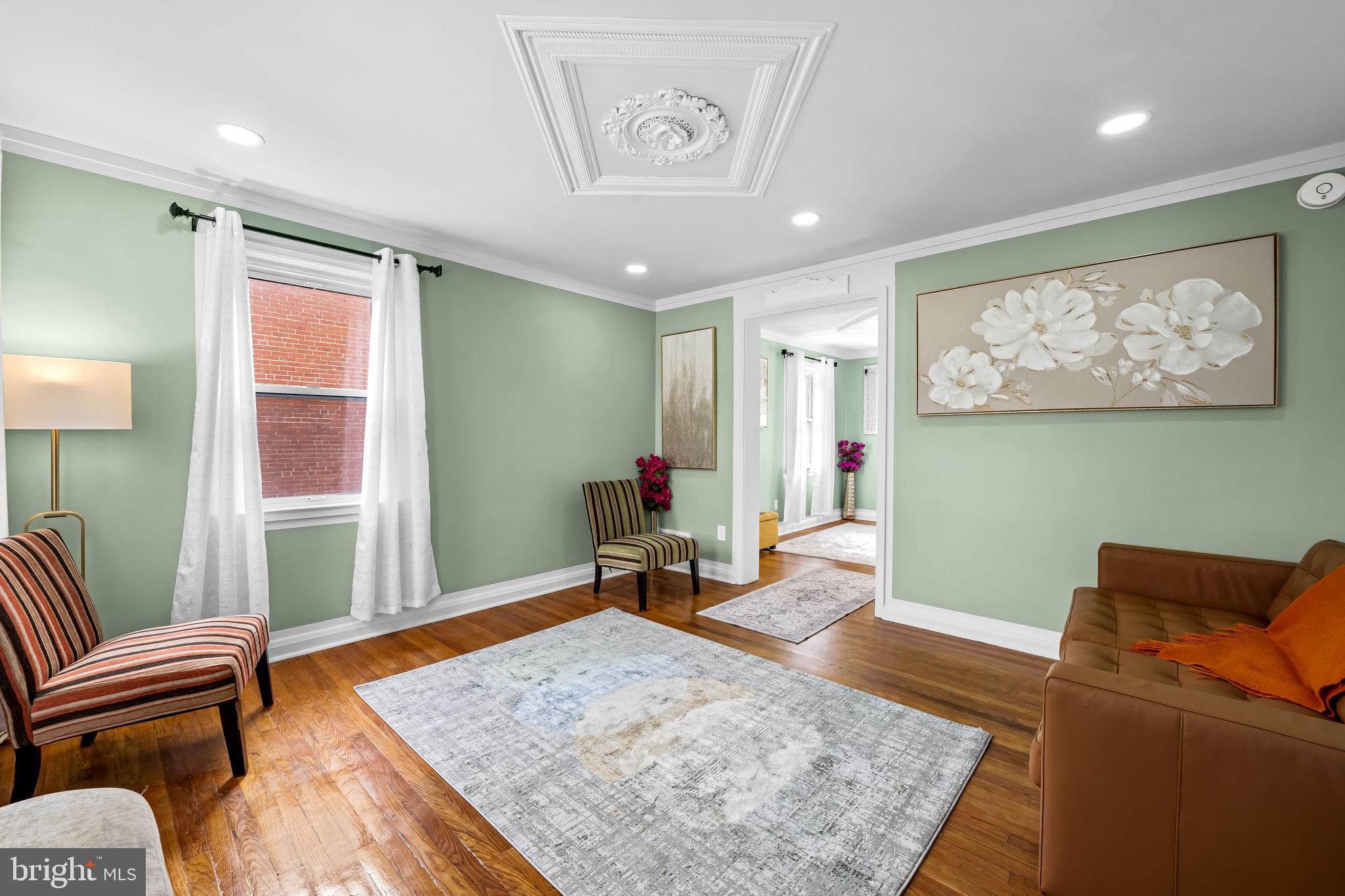 66 Stemmers Run Road Baltimore, MD 21221 - Photo 5 of 24 a living room with furniture and a flat screen tv