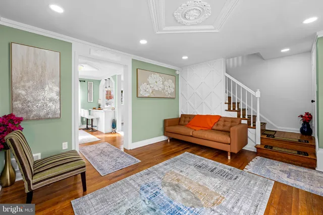 a bedroom with furniture and a rug