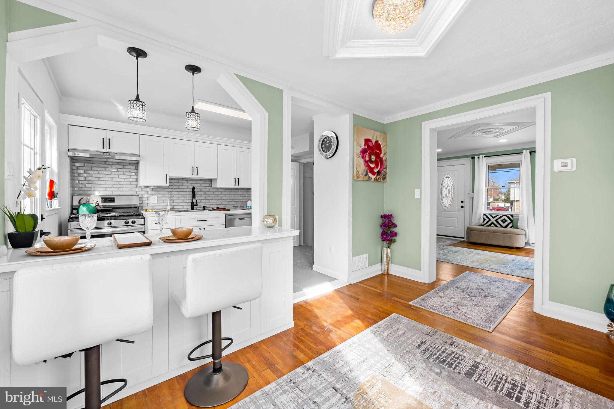 66 Stemmers Run Road Baltimore, MD 21221 - Photo 7 of 24 a living room with furniture and a wooden floor