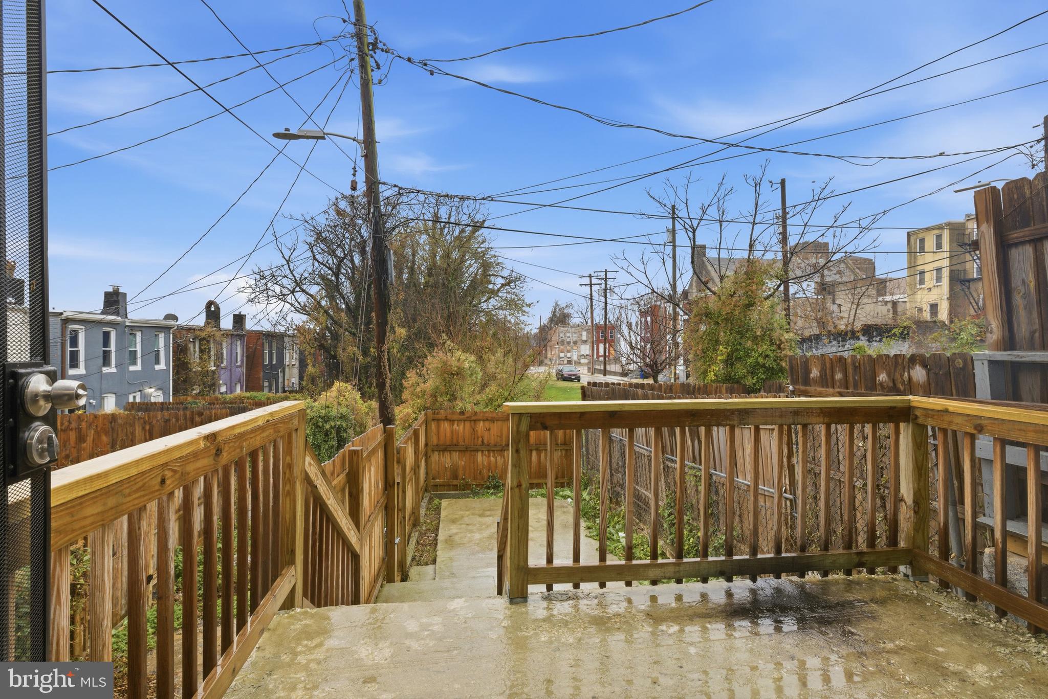 16 South Payson Street Baltimore, MD 21223 - Photo 15 of 16 a view of a balcony with wooden fence
