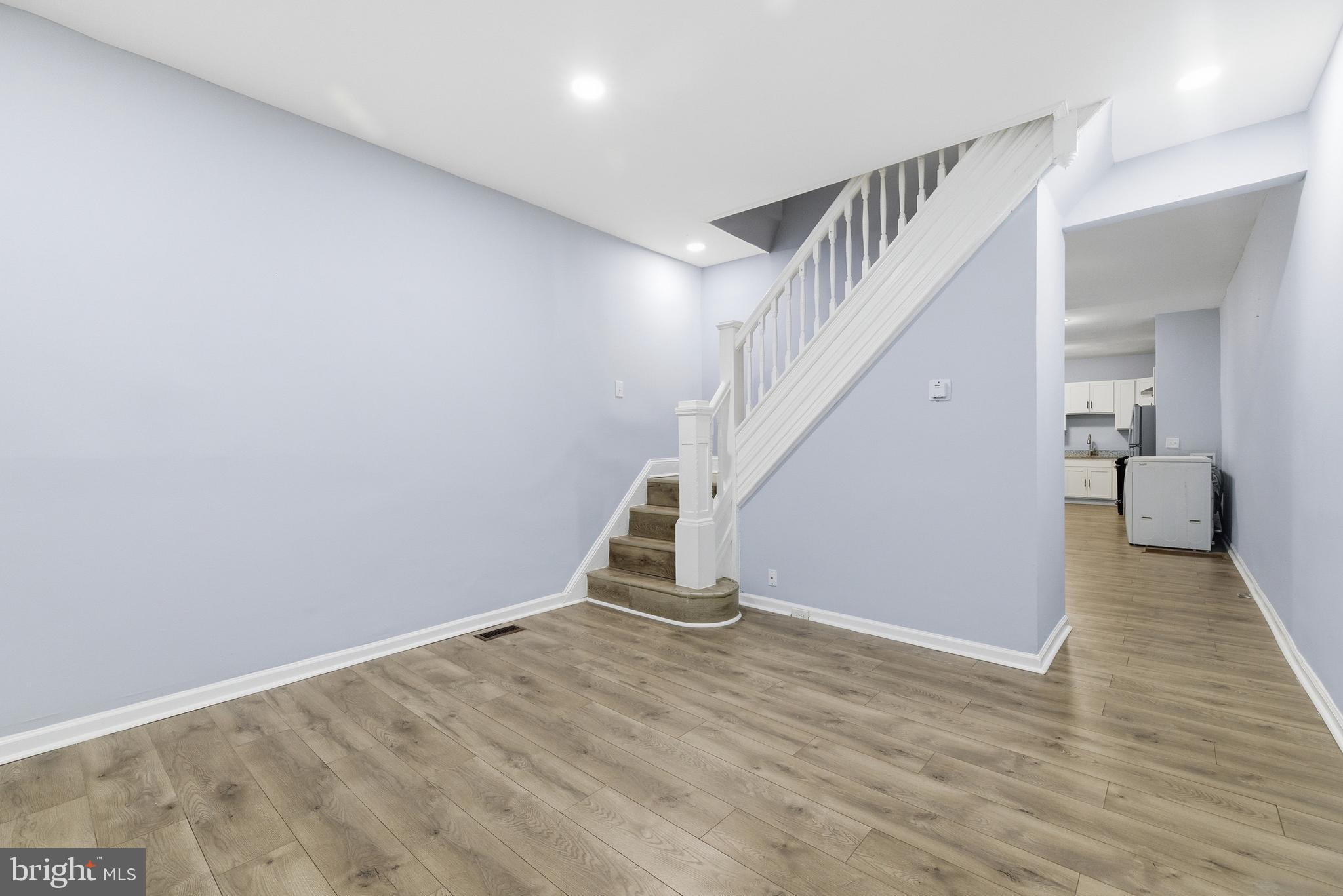 16 South Payson Street Baltimore, MD 21223 - Photo 4 of 16 a view of an empty room with wooden floor