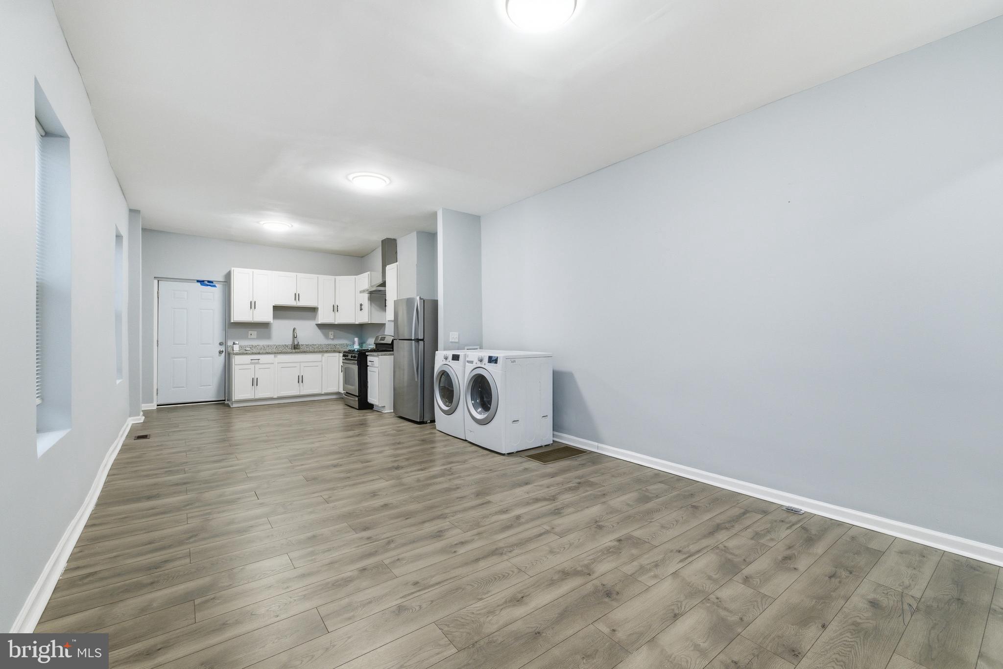 16 South Payson Street Baltimore, MD 21223 - Photo 5 of 16 a view of a kitchen with wooden floor
