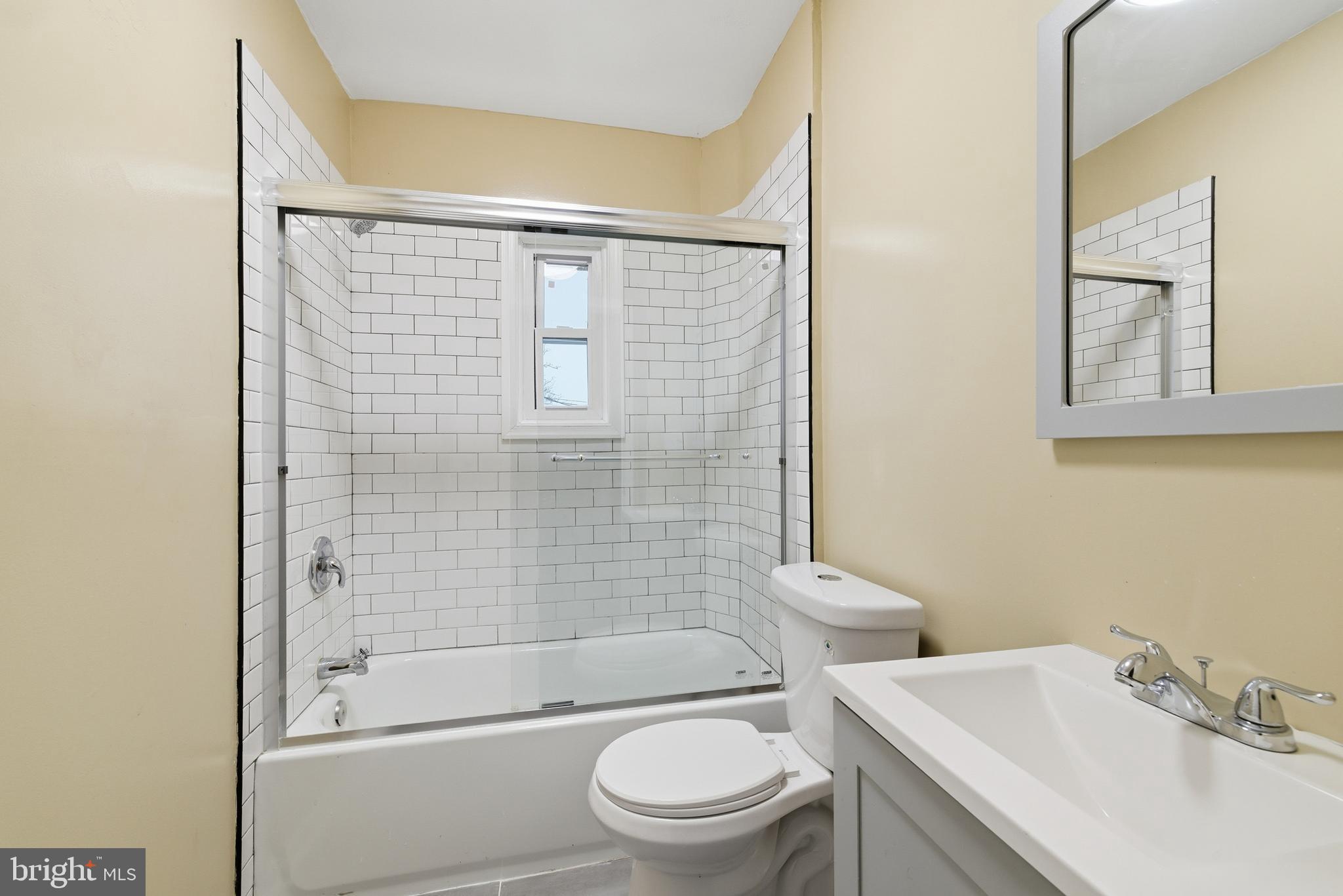 16 South Payson Street Baltimore, MD 21223 - Photo 8 of 16 a bathroom with a sink toilet and shower