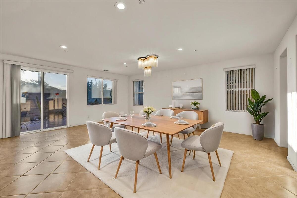 a view of a dining room with furniture and window