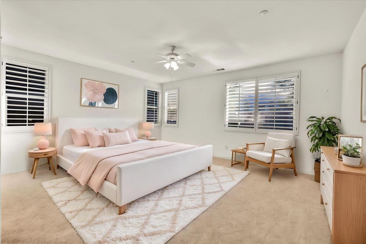 3467 Savanna Way Palm Springs, CA 92262 - Photo 17 of 49 a spacious bedroom with a bed and a couch