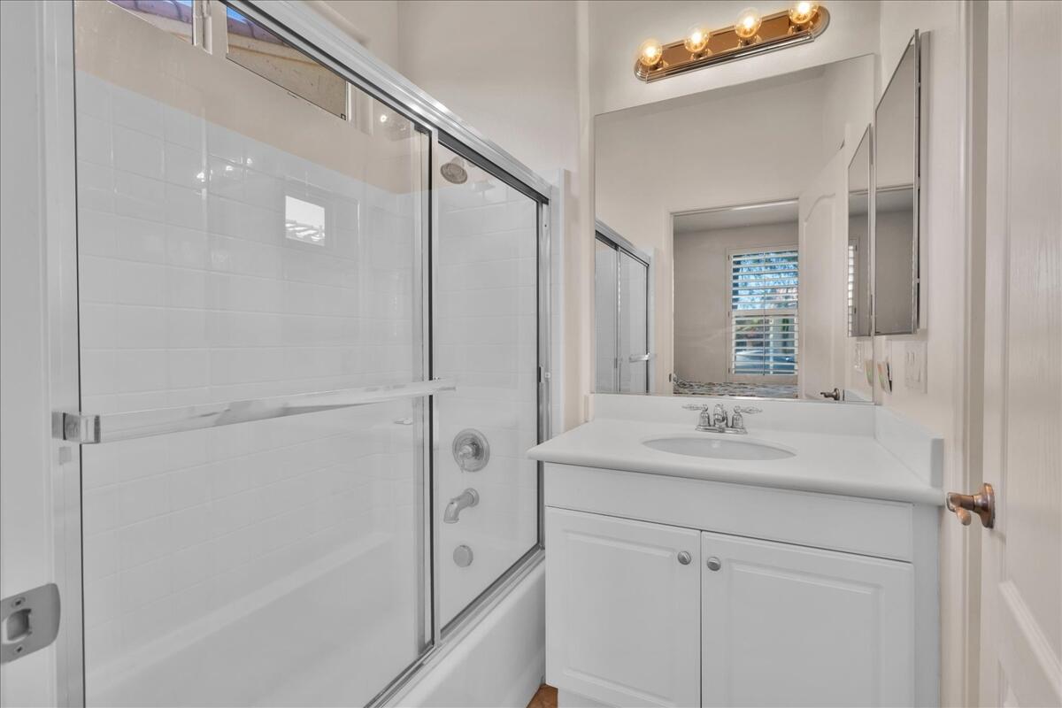 3467 Savanna Way Palm Springs, CA 92262 - Photo 23 of 49 a bathroom with a shower sink and mirror