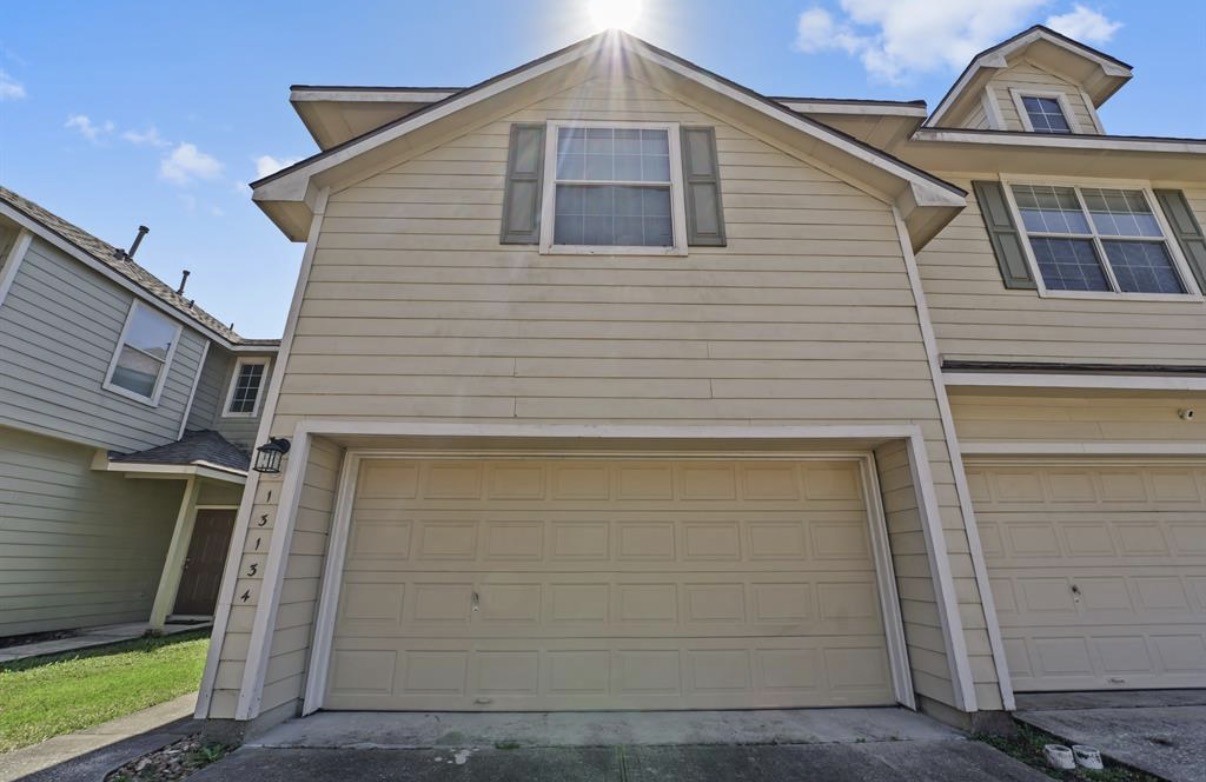 13134 Peppergate Lane Houston, TX 77044 - Photo 2 of 23 a front view of a house with a garage