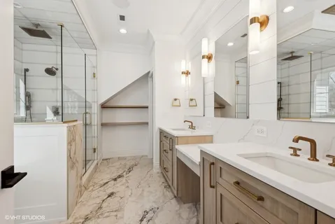 a bathroom with a sink double vanity and shower