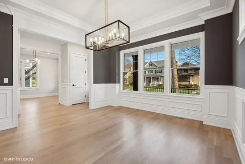 a view of an entryway with wooden floor and a window