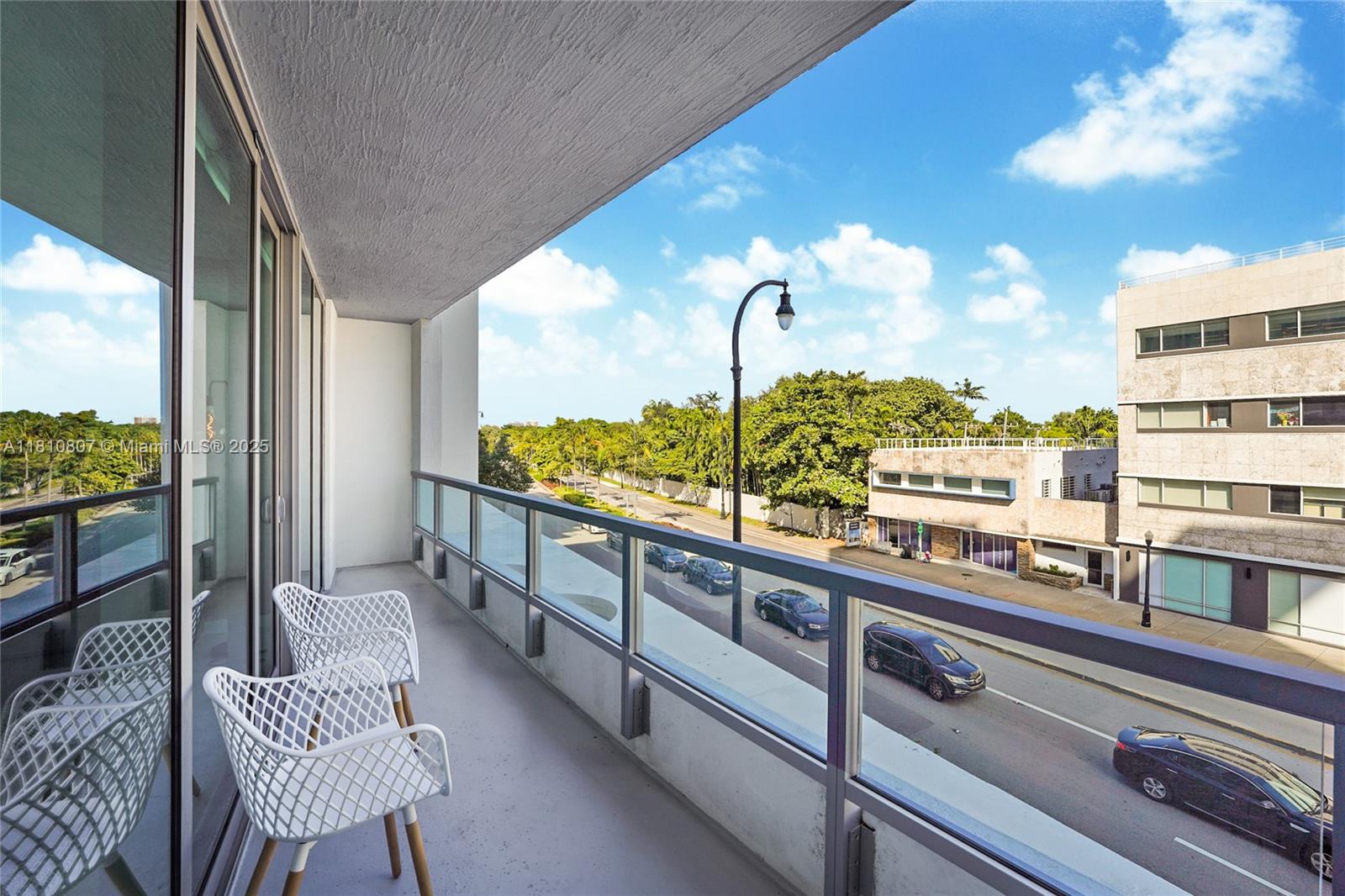 3900 Biscayne Boulevard, Unit S218 Miami, FL 33137 - Photo 11 of 36 a view of a city from a balcony with furniture