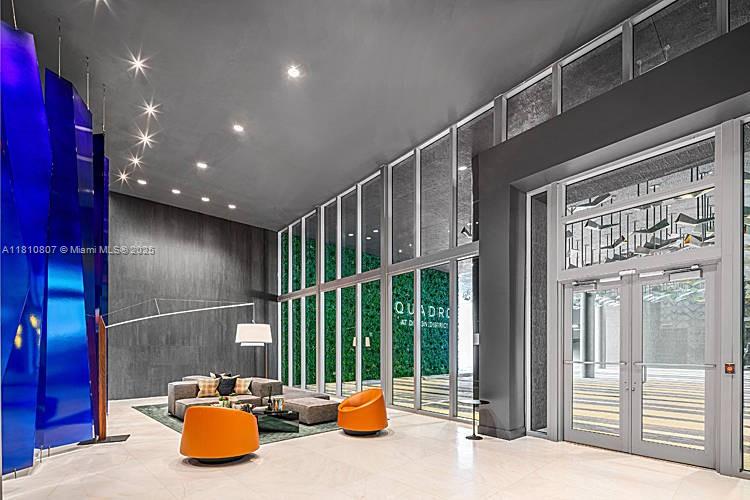 3900 Biscayne Boulevard, Unit S218 Miami, FL 33137 - Photo 15 of 36 a view of lobby with a tv and glass door