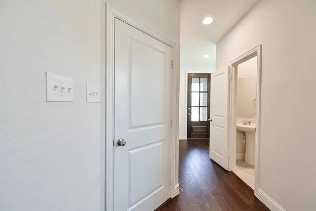 a view of a big room with wooden floor and windows in a room