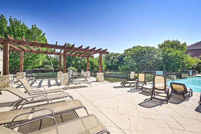 a view of swimming pool with outdoor seating
